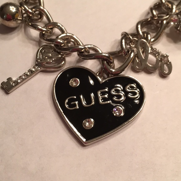NWT Guess silver tone metal multi charm bracelet - Picture 2 of 4